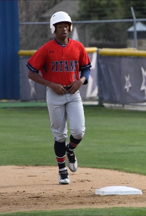 Karmelo Anthony in baseball uniform, running bases